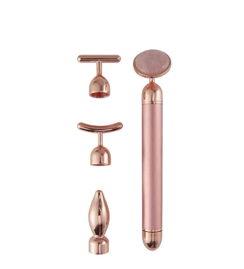 Appareil massage anti-âge maison avec quatre accessoires en métal rose pour le soin du visage