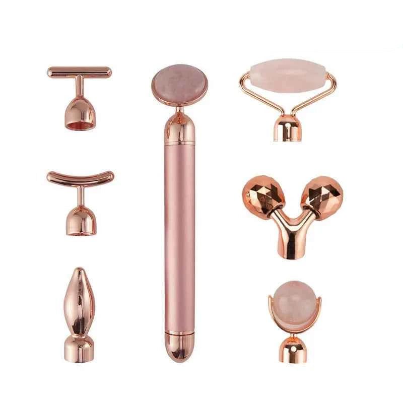Ensemble d'appareil massage anti-âge maison en rose avec différents accessoires pour soins du visage