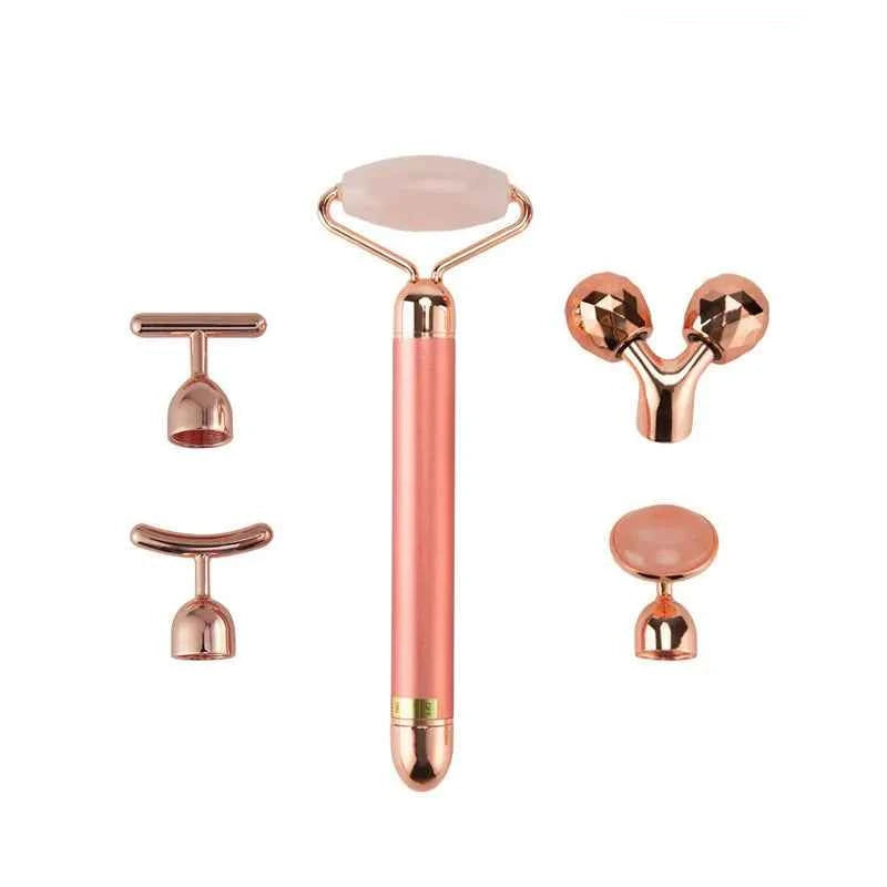 Set d'appareil massage anti-âge maison avec rouleau et accessoires en rose et or pour soins de la peau