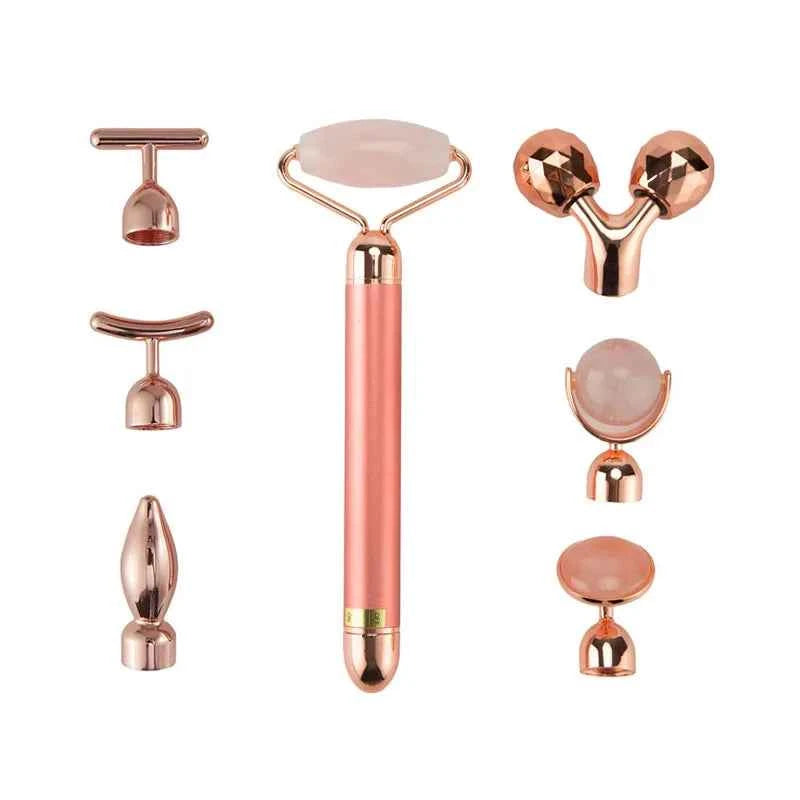 Appareil massage anti-âge maison avec rouleau et accessoires en rose pour un soin efficace de la peau