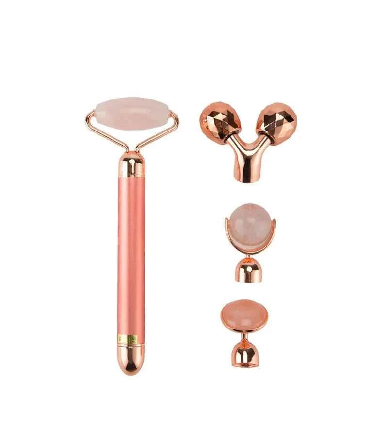 Appareil massage anti-âge maison avec rouleau en rose et accessoires pour soins du visage