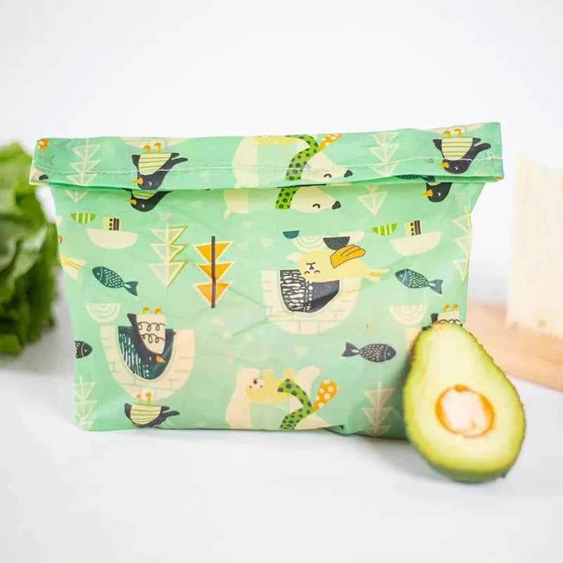 Sac alimentaire en cire d'abeille avec motifs colorés et ouverture pliable pour une conservation durable