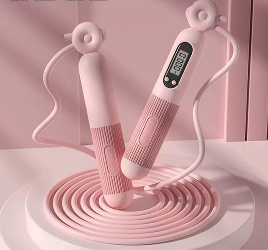 Corde à sauter connectée rose avec écran numérique pour suivre les performances d'entraînement