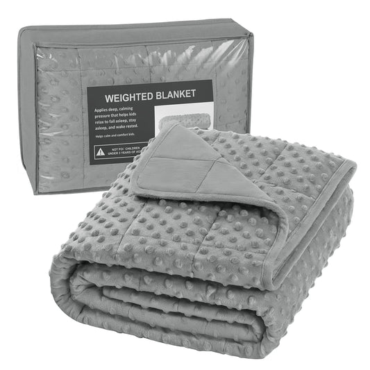 Couverture lestée enfant en tissu doux grisé, idéale pour un sommeil apaisant et confortable